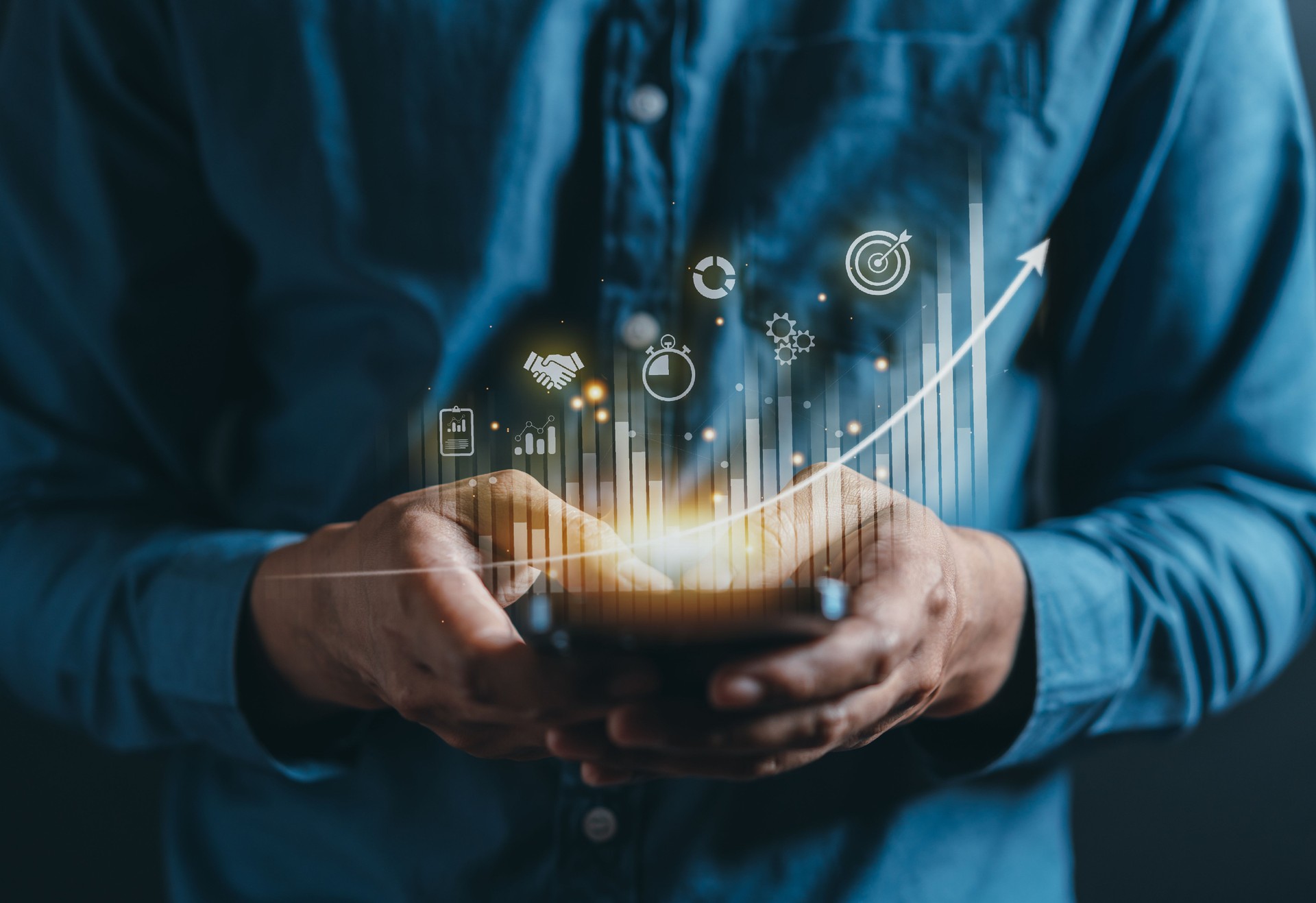 Businessman using mobile phone for analyzing forex trading graph financial data. Business finance technology and investment concept. Stock Market Investments Funds and Digital Assets. Business finance.